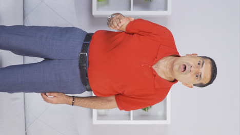 Vertical-video-of-Elderly-man-looking-at-camera-in-amazement.
